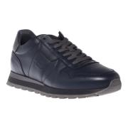 Trainers in dark blue leather and tumbled leather