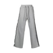 Broderte track pants med duskedetalj