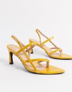 NA-KD pointed sole toe-strap heels in yellow