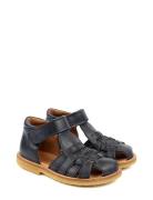 Classic Rub Sole Closed Braid Sanda Navy Pom Pom