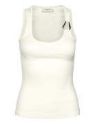 Cmsiv-To Is A Tight-Fitting Top In A Thick, Ribbed Material With A Lot...